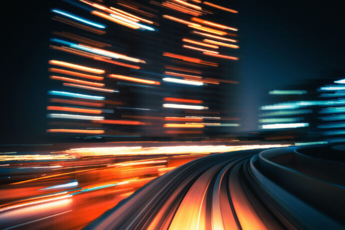 light rail blurred night downtown scene