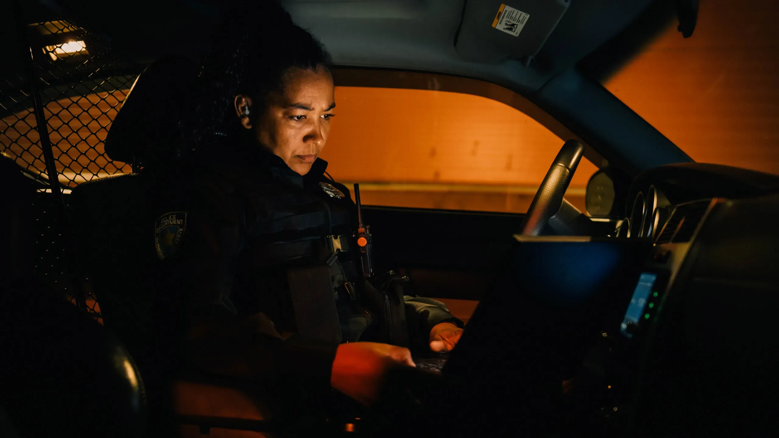 law enforcement officer using technology in vehicle