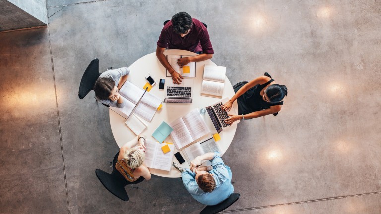 young-people-studying-together-around-table