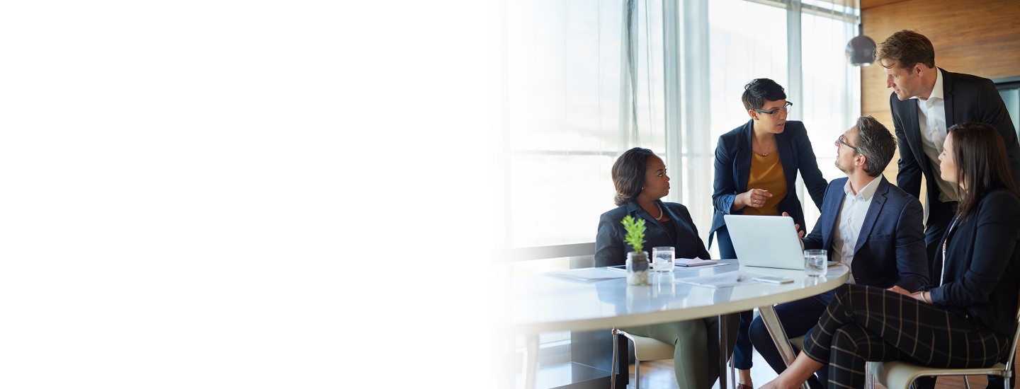 2880x1100 left white gradient of a group of corporate businesspeople working in the boardroom