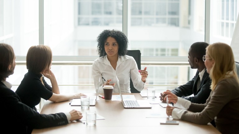 female-boss-leading-corporate-multiracial-team-meeting